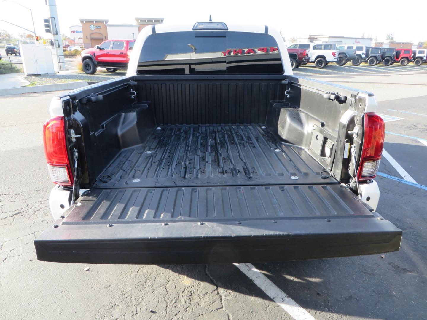 2019 White /black Toyota Tacoma TRD OFF-ROAD Double Cab (3TMAZ5CN4KM) with an 3.5L engine, automatic transmission, located at 2630 Grass Valley Highway, Auburn, CA, 95603, (530) 508-5100, 38.937893, -121.095482 - TRD Offroad 2WD sitting on Fox 2.5 remote reservoir DSC Coil-overs, Total Chaos upper control arms, Rigid Industries Dually side shooter leds, Fuel Rebel wheels, Nitto Ridge Grappler tires, and window tint. - Photo#13